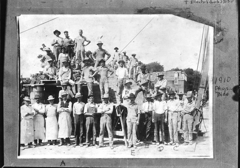 MacLean Hall construction crew pauses for a group portrait in 1910