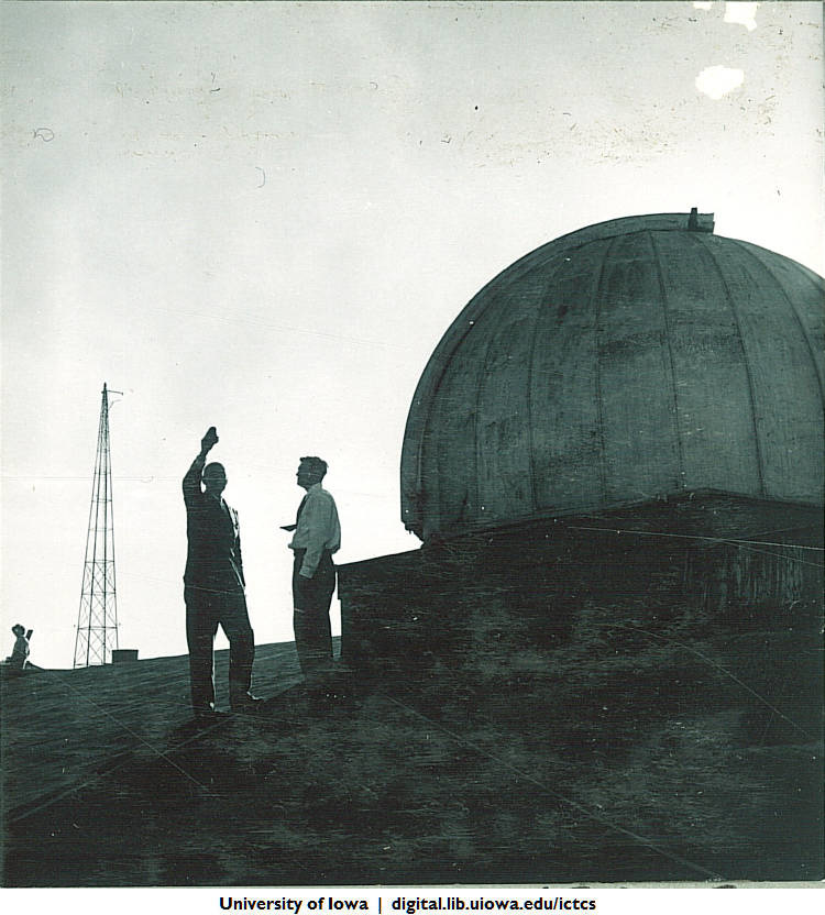 Two men standing next to the MacLean Hall Observatory in the 1930s